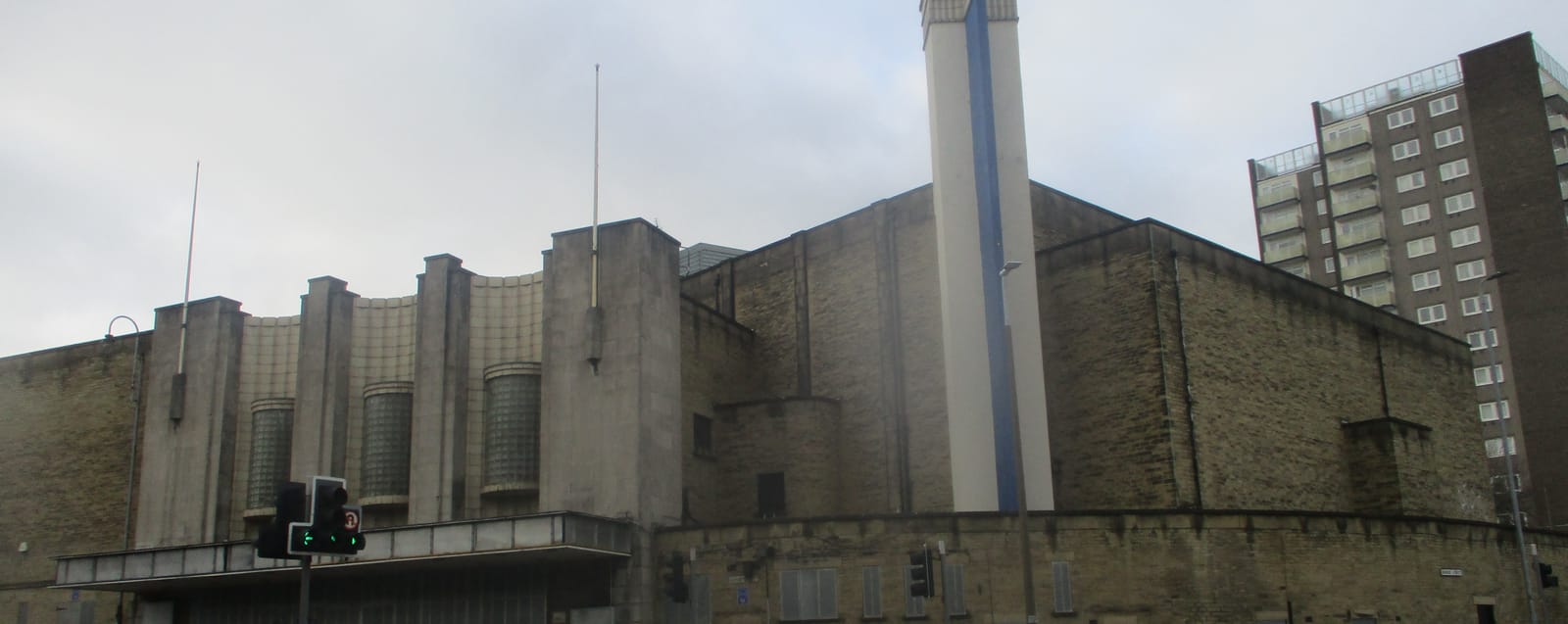 The stone art deco frontage of the former Mecca bingo hall on Broad Street, Halifax, under a grey sky
